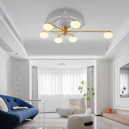 Modern brass glass ceiling lamp with frosted globes for living room