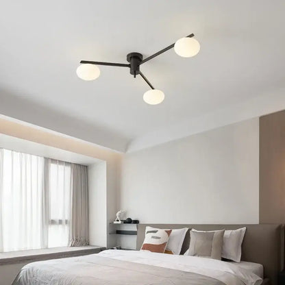 Modern brass glass ceiling lamp with frosted globes for living room