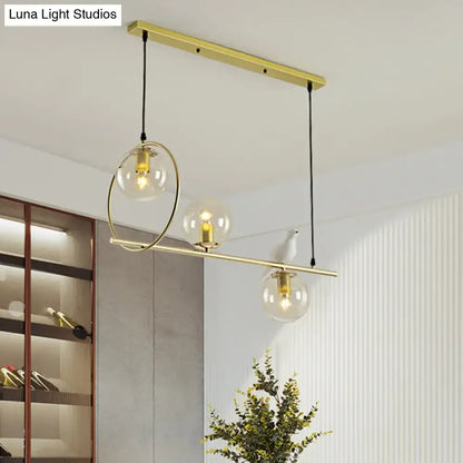 Modern brass global island lamp with white bird dining room light