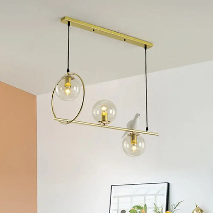 Modern brass global island lamp with white bird dining room light