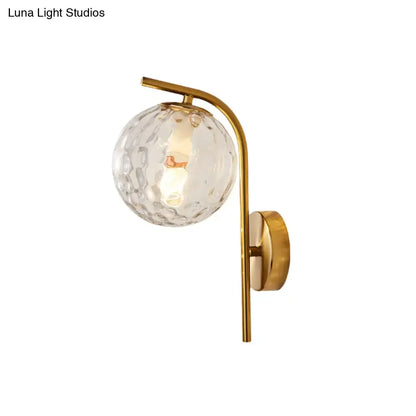 Modern brass globe bedside lamp with frosted glass for bedroom