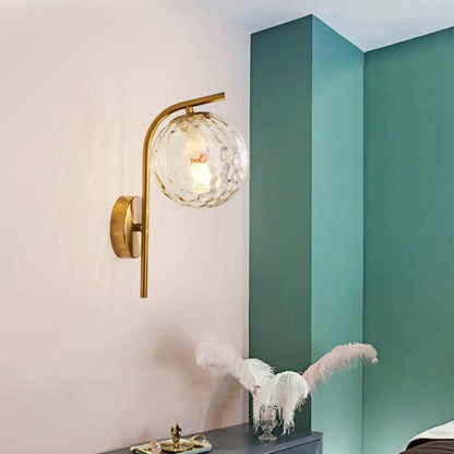 Modern brass globe bedside lamp with frosted glass for bedroom