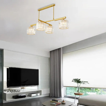 Modern brass hanging light with crystal shades – living room island