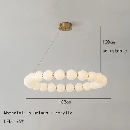 Modern brass led pendant light with frosted spheres for living room