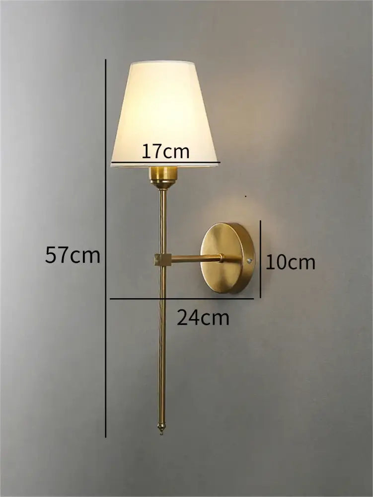 Modern brass led wall sconce with white fabric shade for bedroom