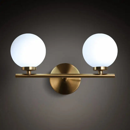 Modern brass light fixture with glass product shade – bedroom sconce
