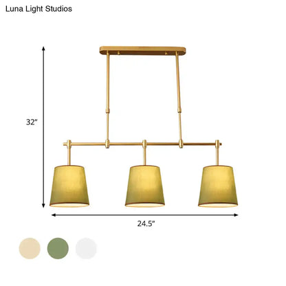 Modern brass pendant light with white green flaxen shades dining room