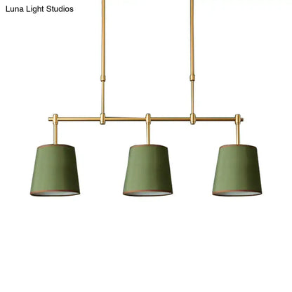 Modern brass pendant light with white green flaxen shades dining room