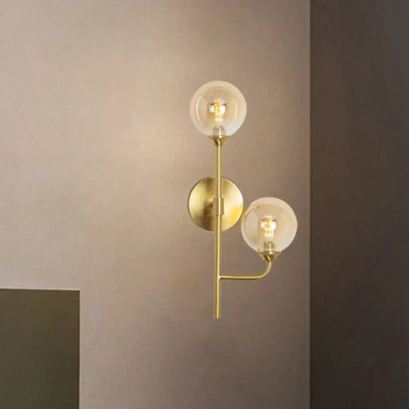 Modern brass sphere wall sconce amber & smoke gray bathroom light