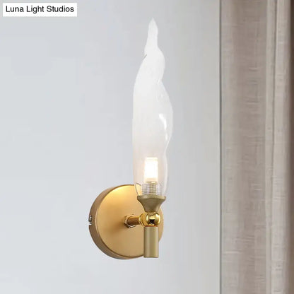 Modern brass torch sconce with clear glass bedroom wall lamp