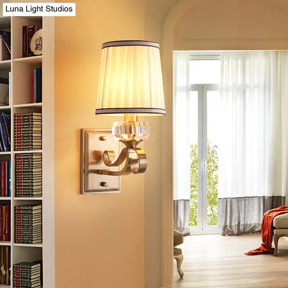 Modern brass wall lamp – bedroom sconce with pleated shade