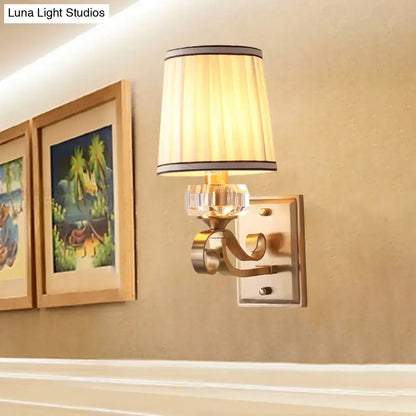Modern brass wall lamp – bedroom sconce with pleated shade