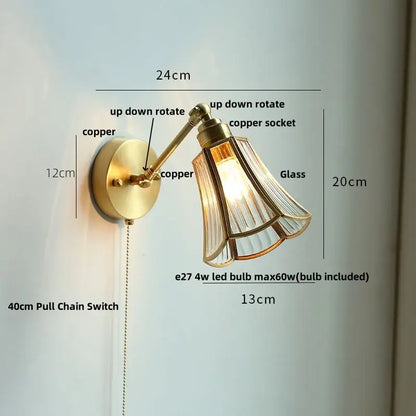 Modern brass wall lamp with clear glass shade bedroom reading light