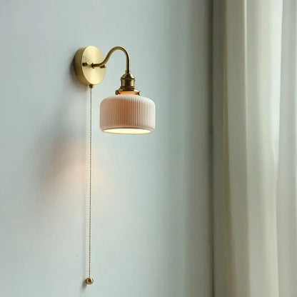 Modern brass wall lamp with ribbed glass shade – bedroom reading light
