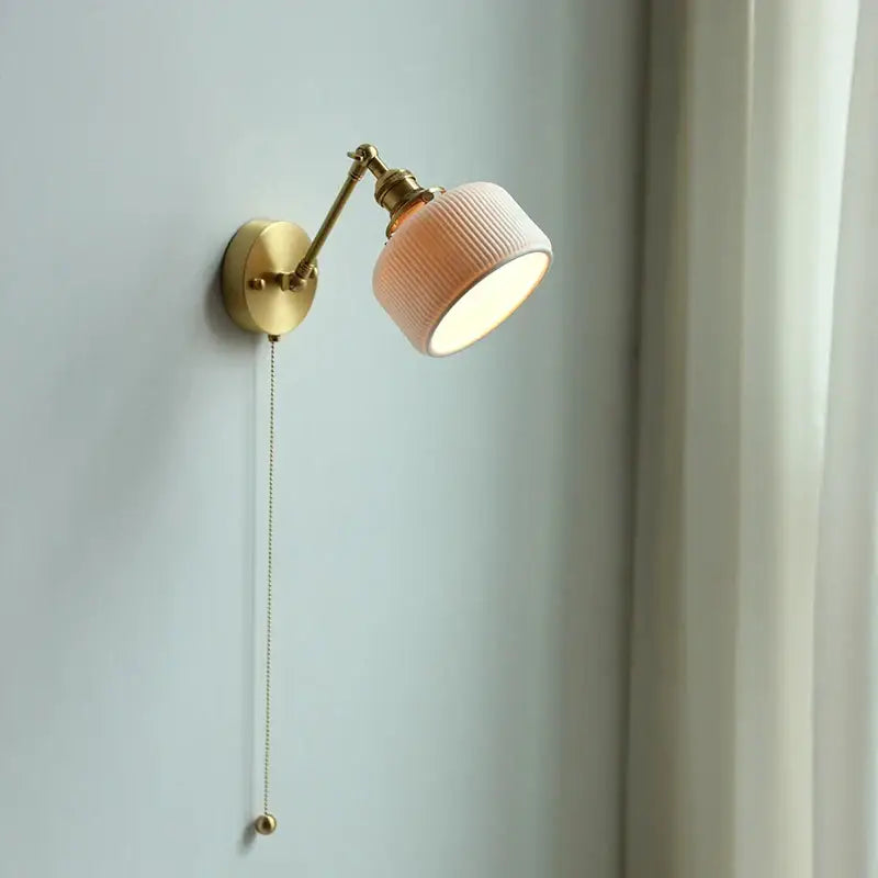 Modern brass wall lamp with ribbed glass shade – bedroom reading light