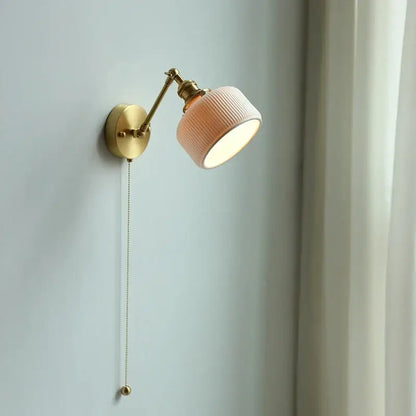 Modern brass wall lamp with ribbed glass shade – bedroom reading light