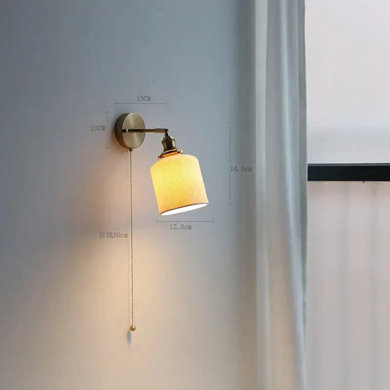 Modern brass wall lamp with ribbed glass shade – bedroom reading light