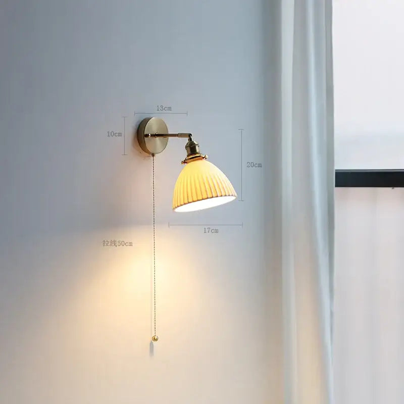Modern brass wall lamp with ribbed glass shade – bedroom reading light