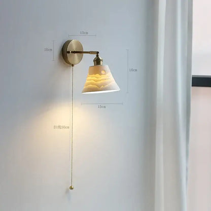 Modern brass wall lamp with ribbed glass shade – bedroom reading light