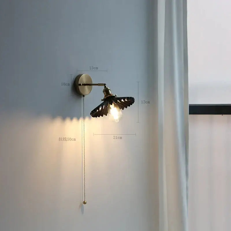 Modern brass wall lamp with ribbed glass shade – bedroom reading light