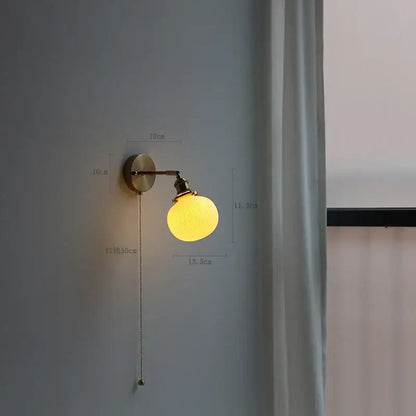 Modern brass wall lamp with ribbed glass shade – bedroom reading light