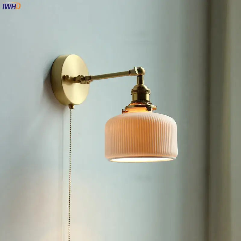 Modern brass wall lamp with ribbed glass shade – bedroom reading light