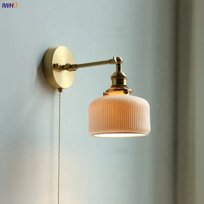 Modern brass wall lamp with ribbed glass shade – bedroom reading light