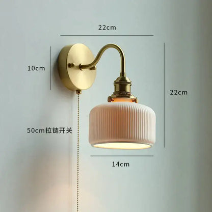 Modern brass wall lamp with ribbed glass shade – bedroom reading light