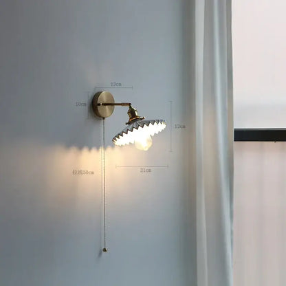 Modern brass wall lamp with ribbed glass shade – bedroom reading light