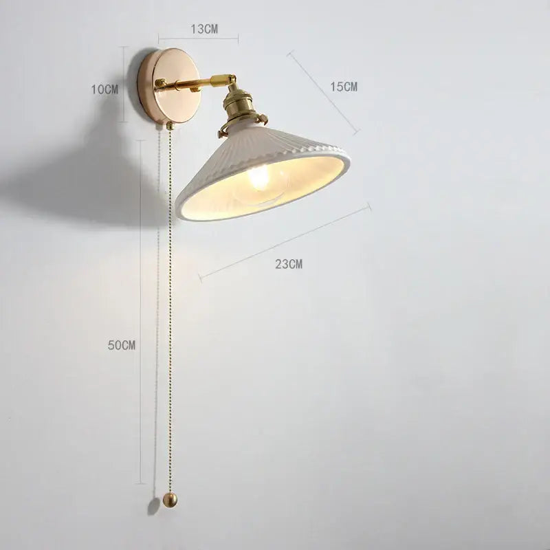 Modern brass wall lamp with ribbed glass shade – bedroom reading light