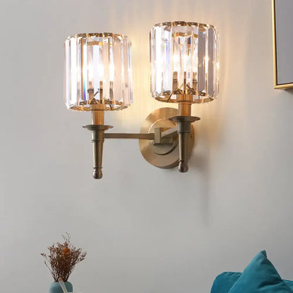 Modern brass wall light sconce with crystal shade for bedroom