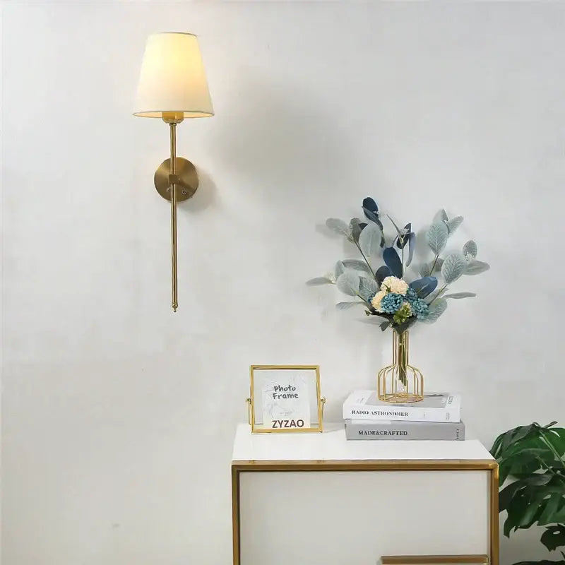 Modern brass wall sconce with white shade – dining room gold touch led