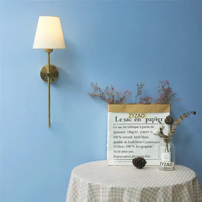 Modern brass wall sconce with white shade – dining room gold touch led