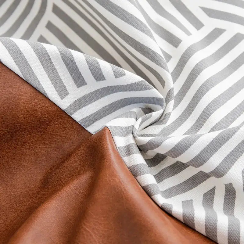 Modern brown faux leather and geometric pillow cover living room