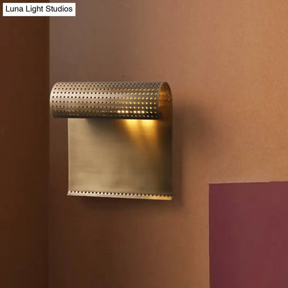 Modern brushed brass scrolled wall sconce for bedroom lighting