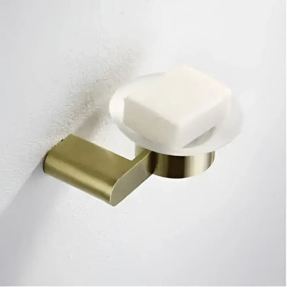 Modern brushed gold bathroom hardware set with shelf and phone holder