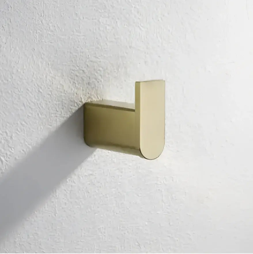 Modern brushed gold bathroom hardware set with shelf and phone holder