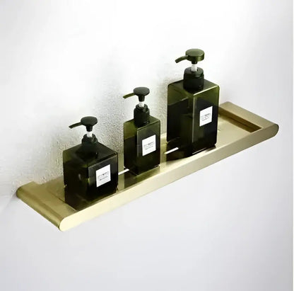 Modern brushed gold bathroom hardware set with shelf and phone holder