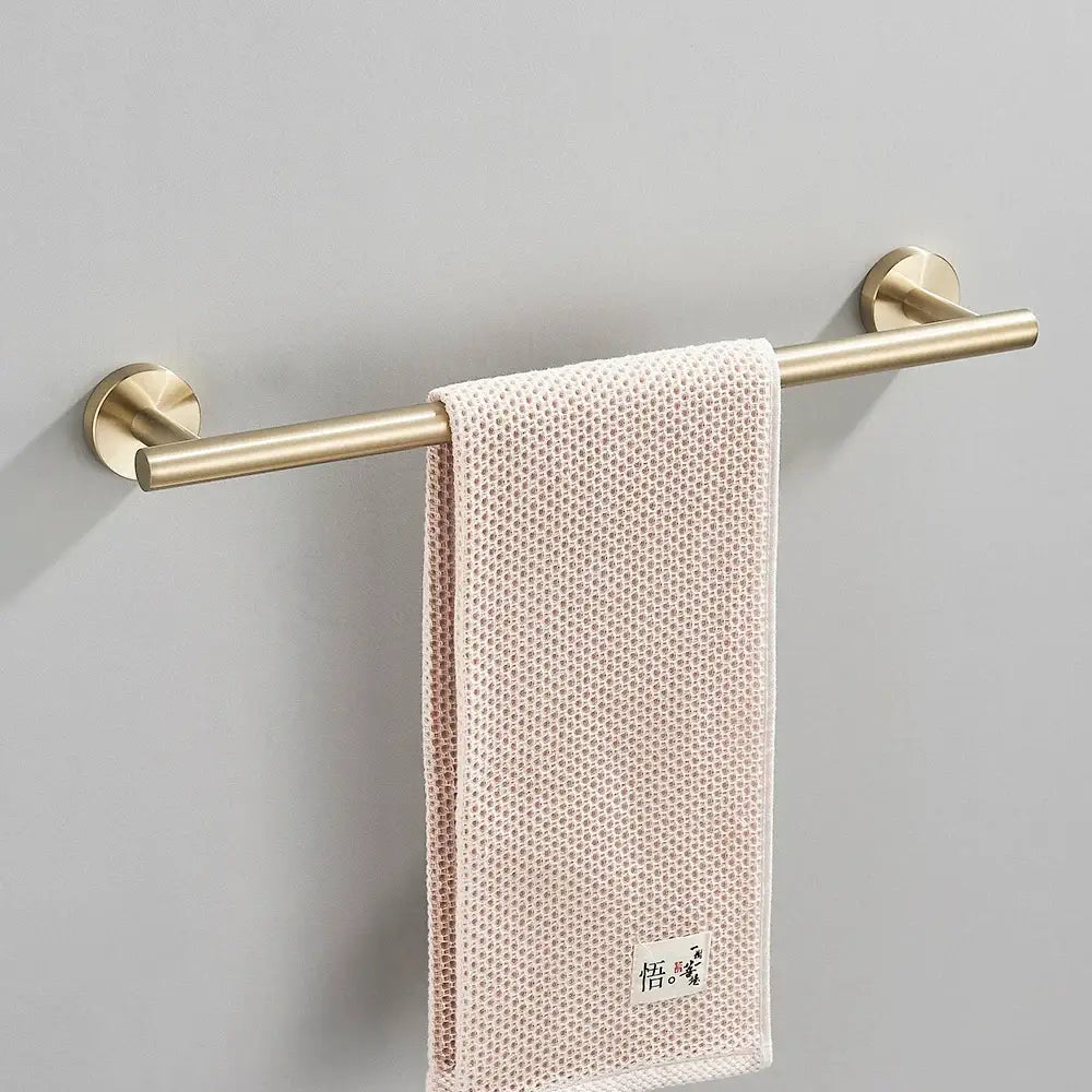 Modern brushed gold bathroom hardware set with towel bar and hooks