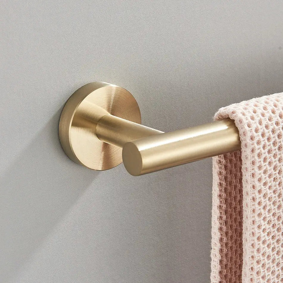 Modern brushed gold bathroom hardware set with towel rack and hooks