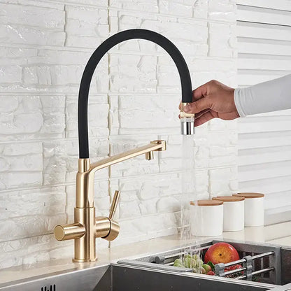 Modern brushed gold swivel kitchen faucet with black rubber hose