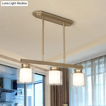 Modern brushed nickel pendant light with clear glass shade dining room