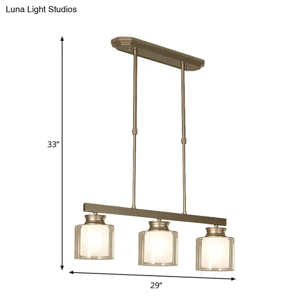 Modern brushed nickel pendant light with clear glass shade dining room