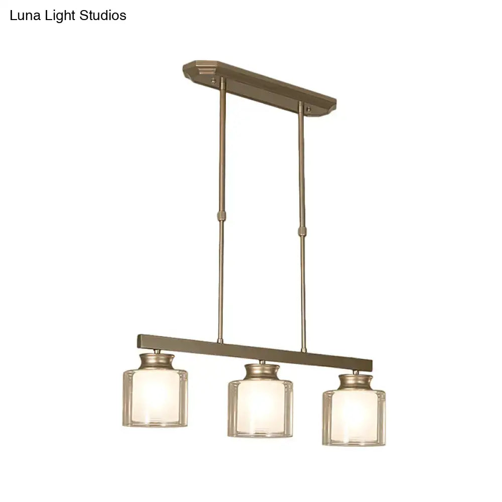 Modern brushed nickel pendant light with clear glass shade dining room