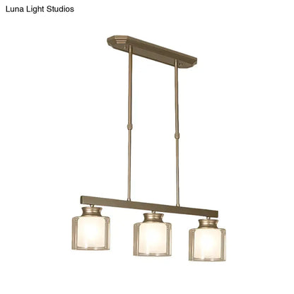 Modern brushed nickel pendant light with clear glass shade dining room