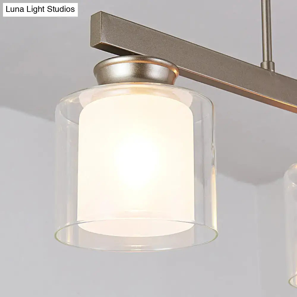 Modern brushed nickel pendant light with clear glass shade dining room