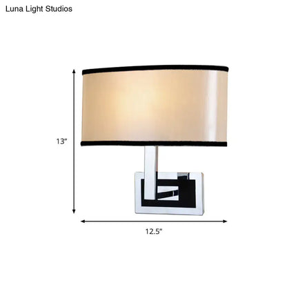 Modern chrome and beige oval wall sconce bedroom light