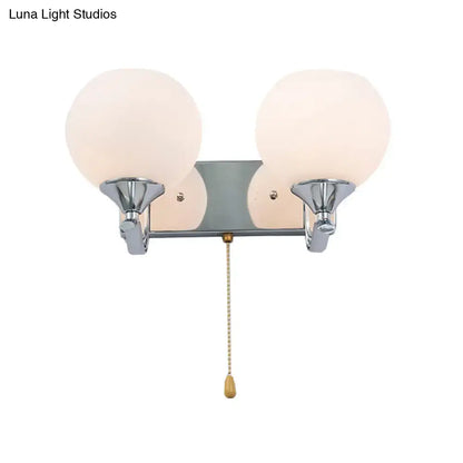 Modern chrome and cream glass wall light bedroom sconce with pull chain