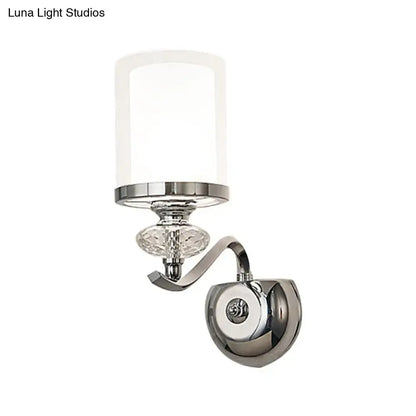 Modern chrome dual cylinder bathroom sconce with curvy arm