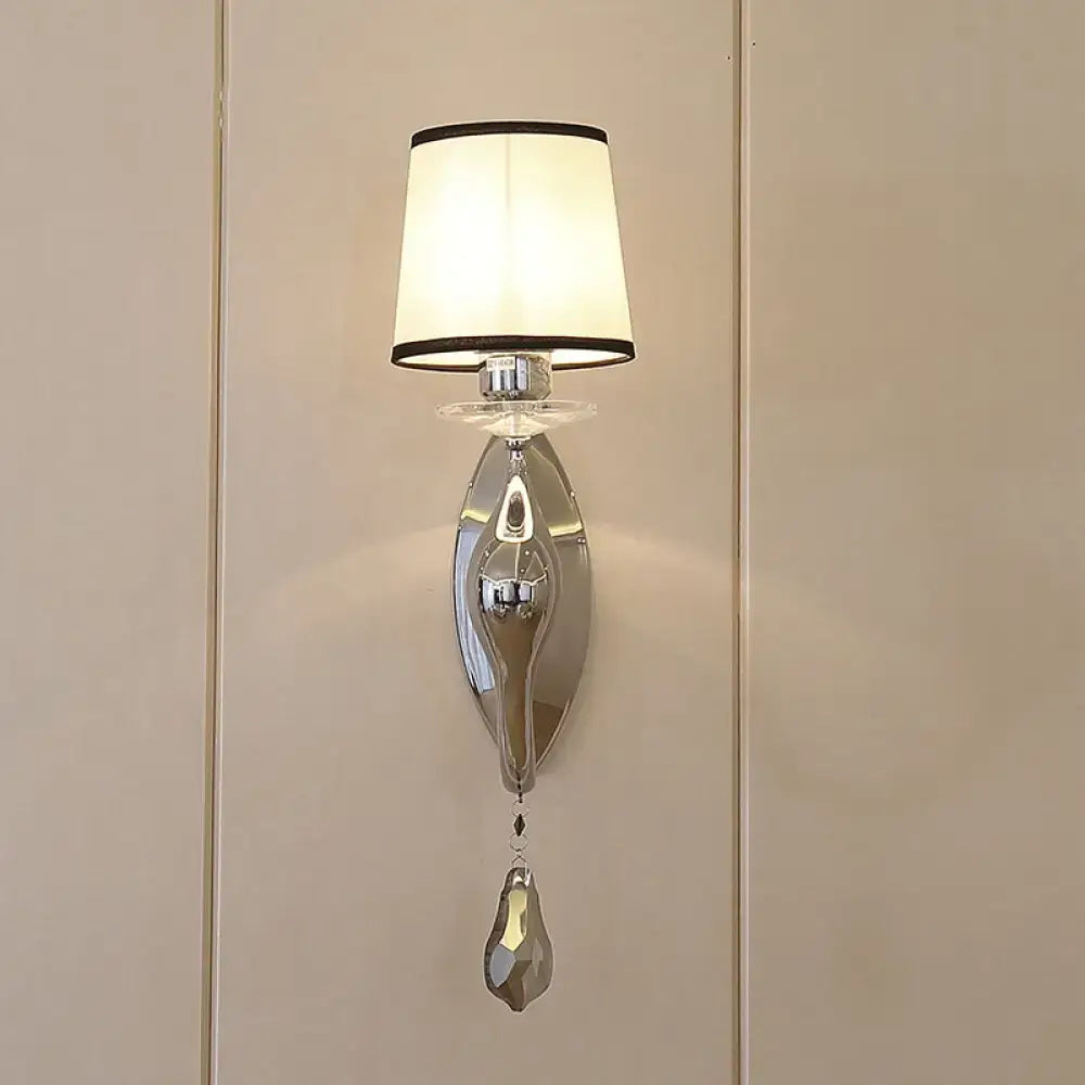 Modern chrome wall lamp with fabric shade and crystal – living room